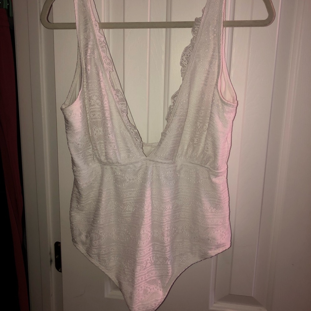 White lowcut one piece bathing suit